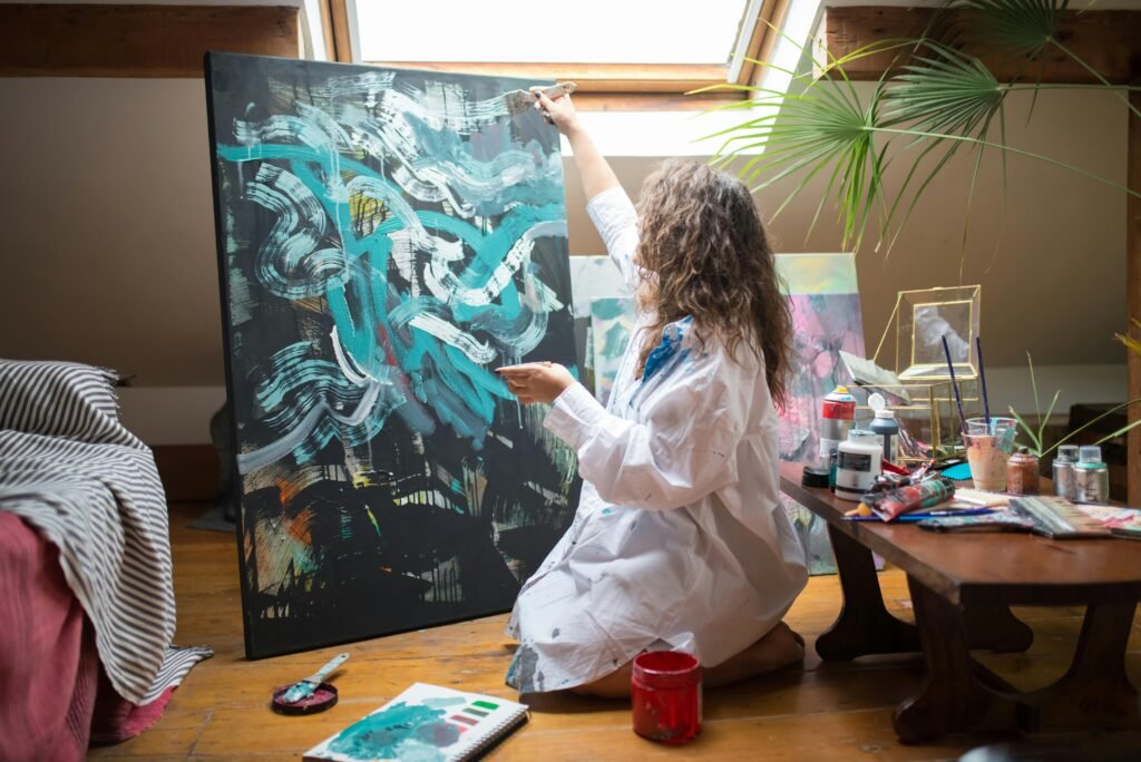 A woman making an abstract painting due to release in her emotional status